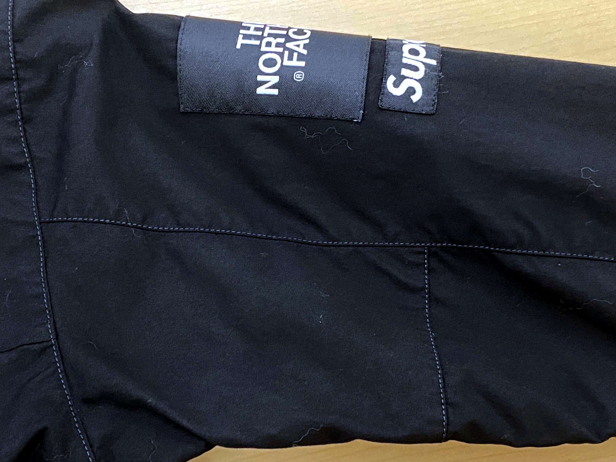 シュプリーム×ノ－スフェイス　コラボジャケットの色褪せ修正・黒染め・染め直し|愛知洗い人｜愛知県染み抜きのできるクリーニング店紹介サイト